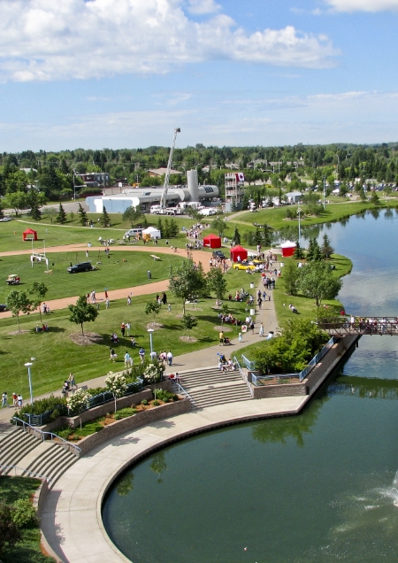 Community members enjoy a warm summer's day alongside Broadmoor Lake.