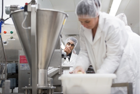 Troika Foods employees working in production.